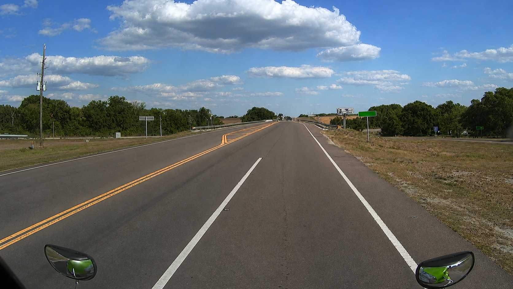 Clean forward roadway view from the W1 outward-facing windshield lens.
