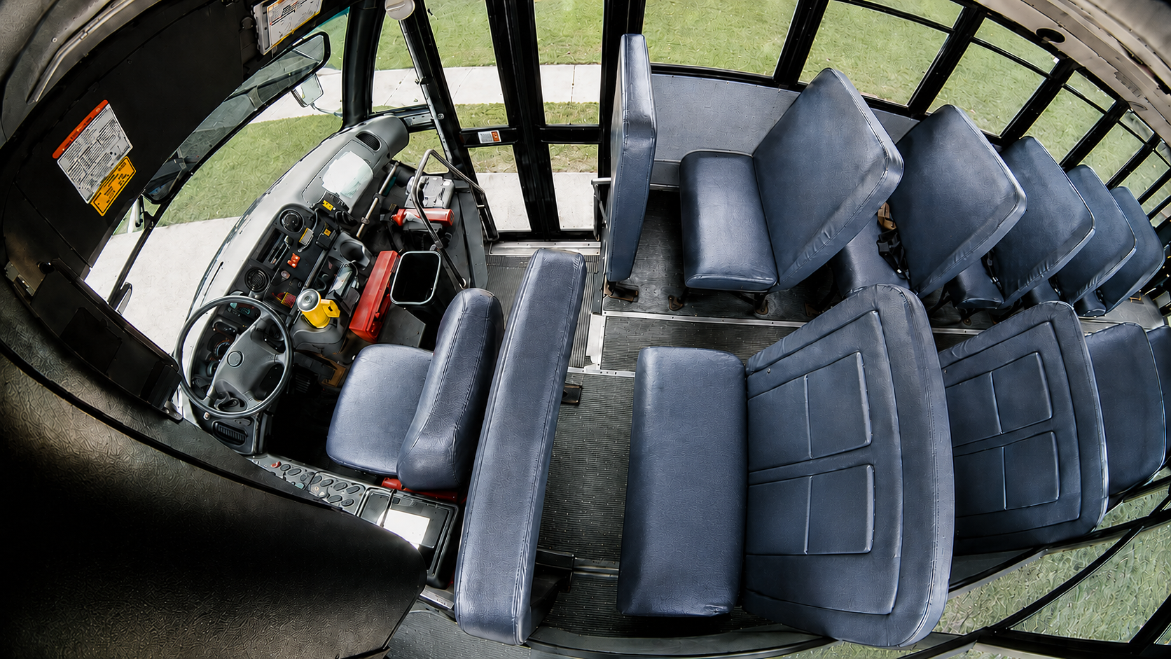 Example wide-angle HD1700V view across the school bus driver area and first passenger rows from camera C1.