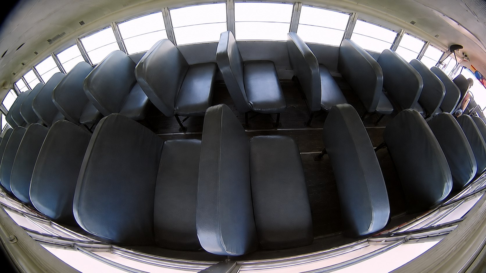Example wide-angle HD1700V view across school bus passenger seats from camera C4.