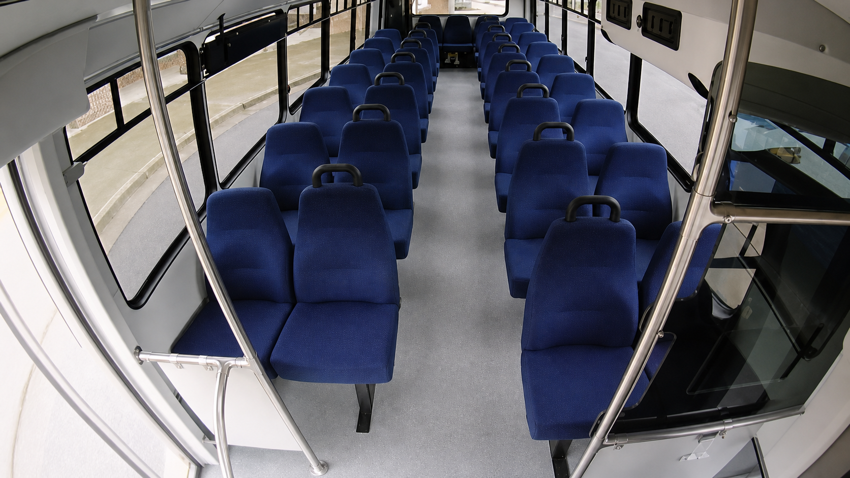 Restored and sharpened C2 rearward transit interior view covering the full passenger aisle and seating rows.