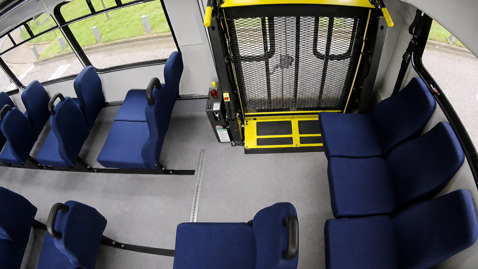 Restored and sharpened C4 transit interior view showing the rear wheelchair lift and surrounding passenger seating.