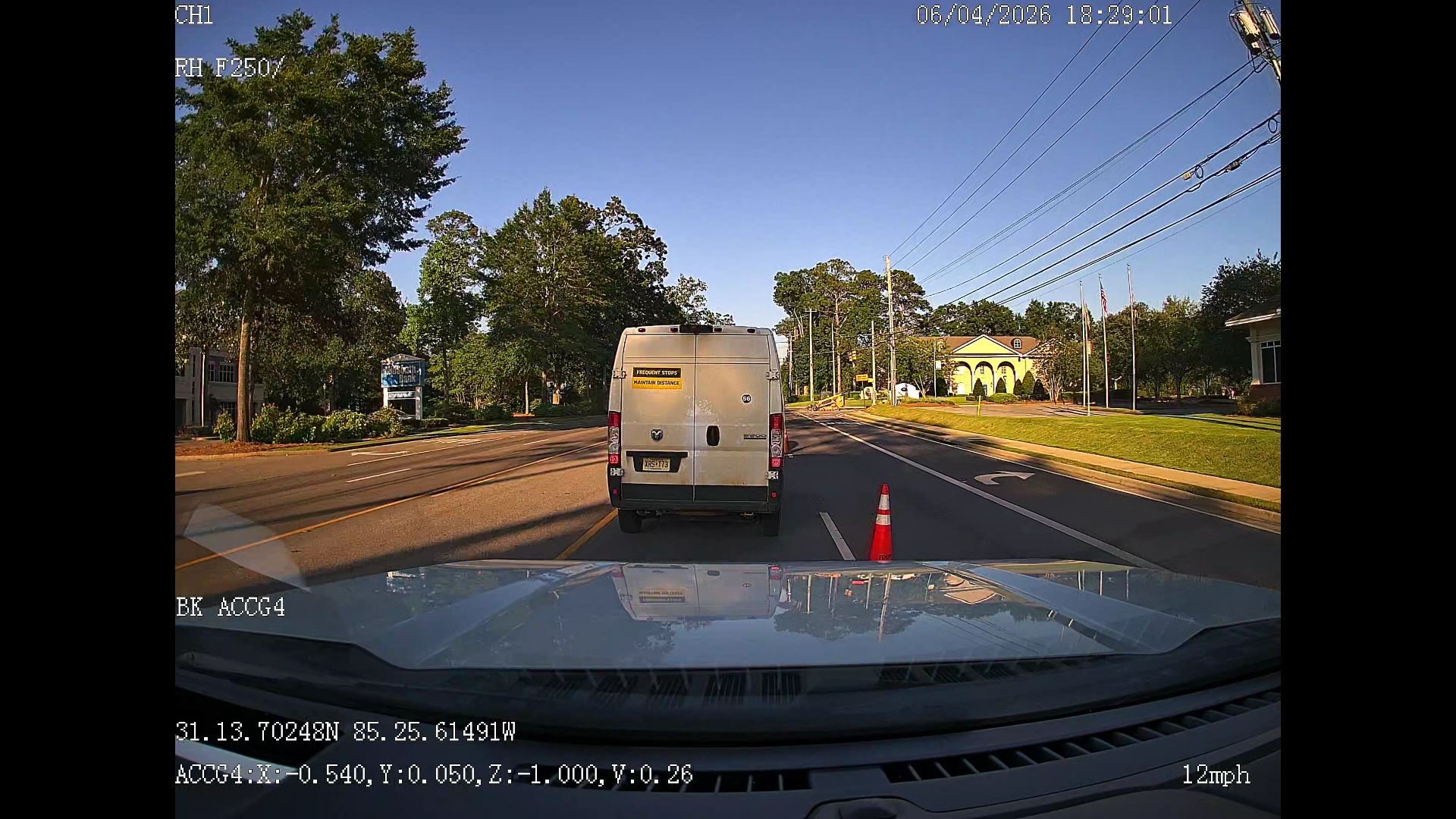 Exterior road-facing VX4AI camera view through a vehicle windshield.